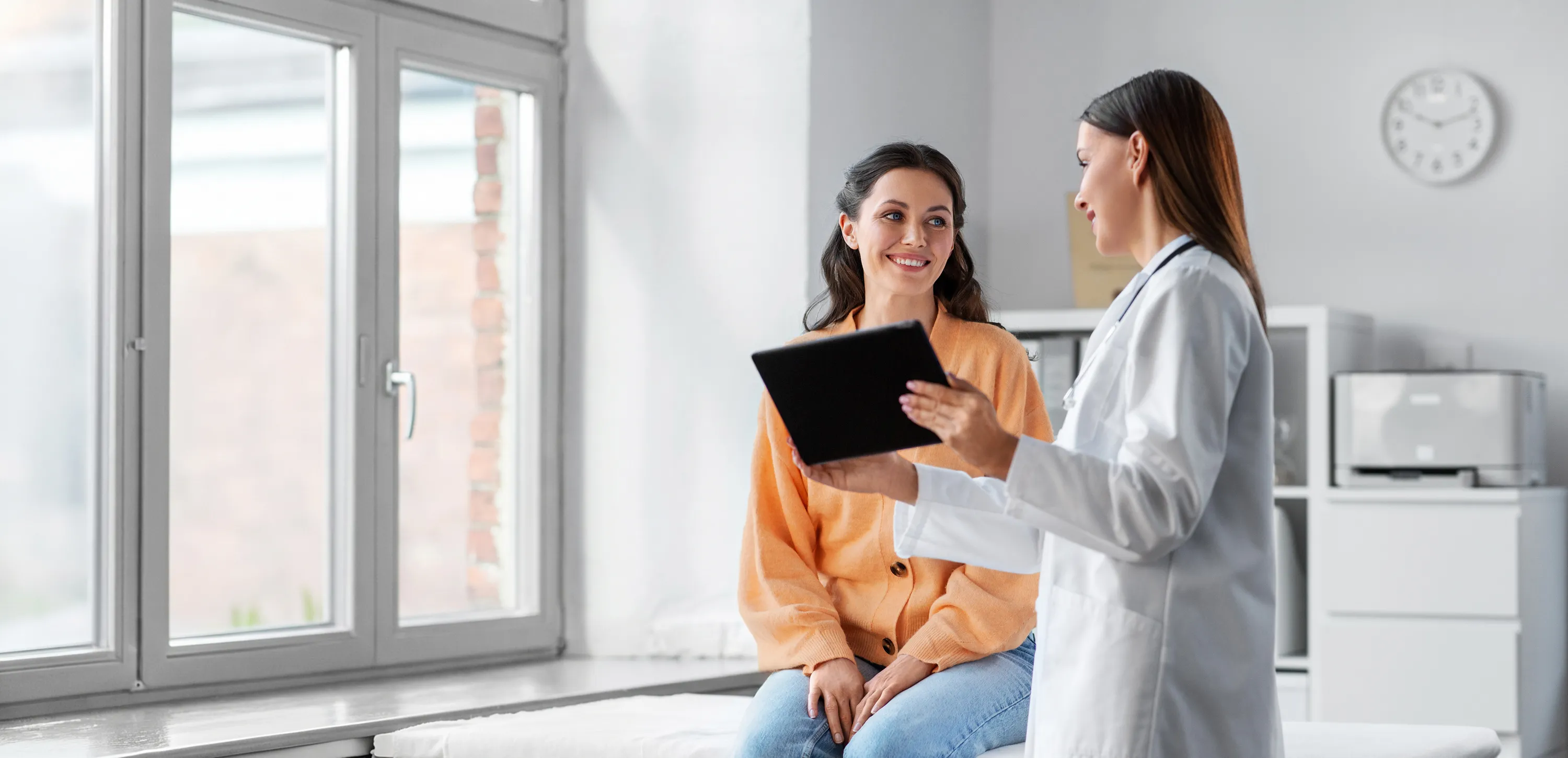 Female doctor and patient in clinic