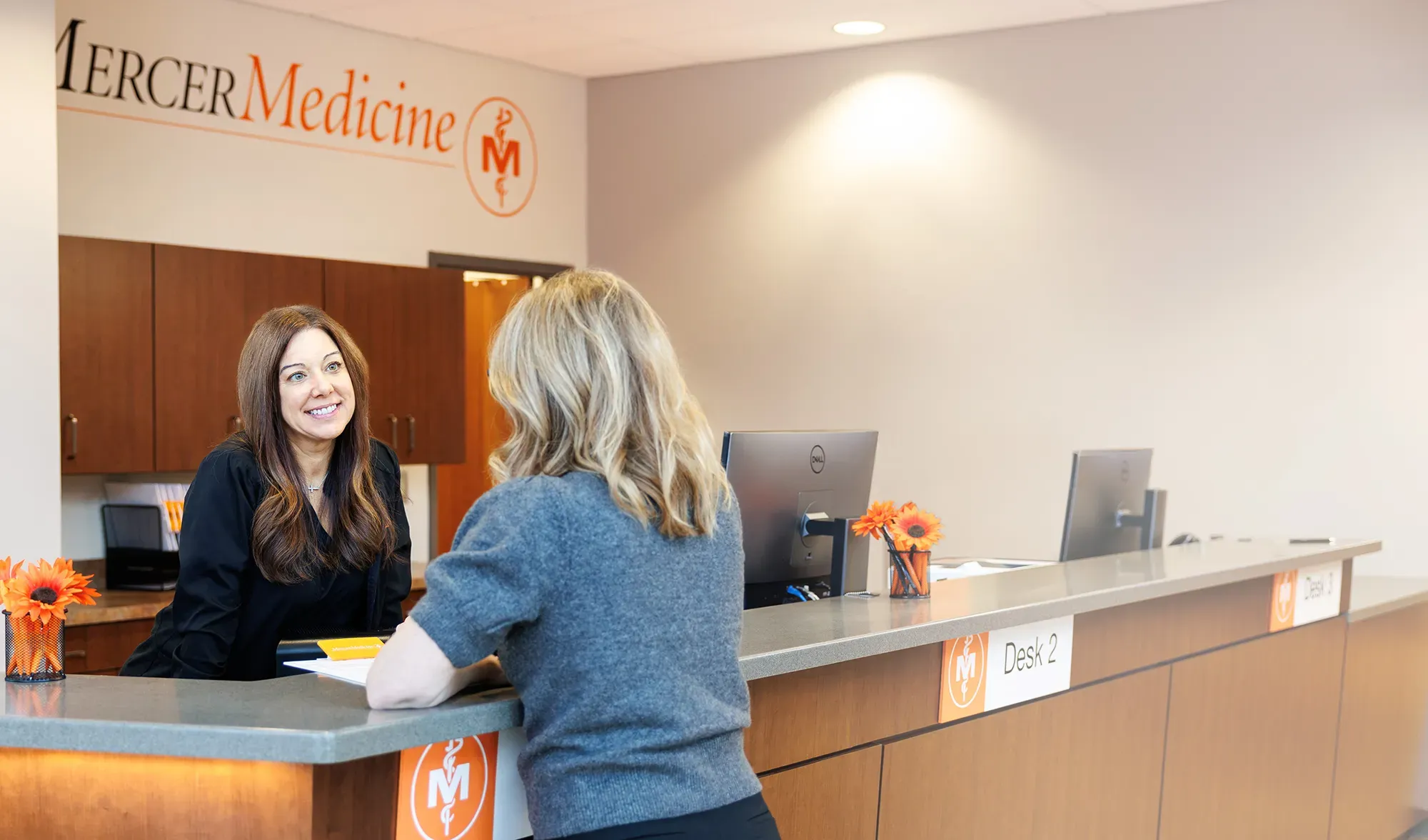 Female patient and staff member in Mercer clinic